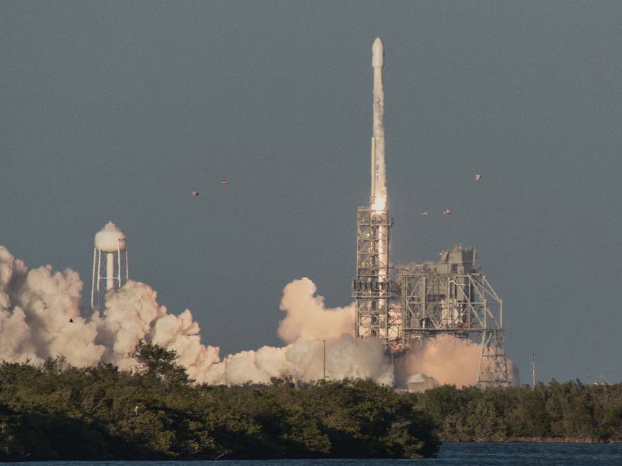 Rocket lifting off from a launch pad
